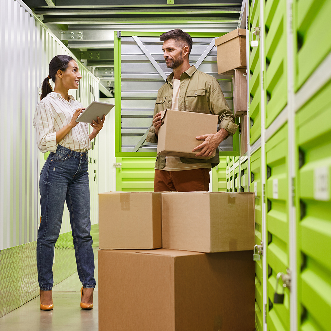 couple outside a storage unit creating a list