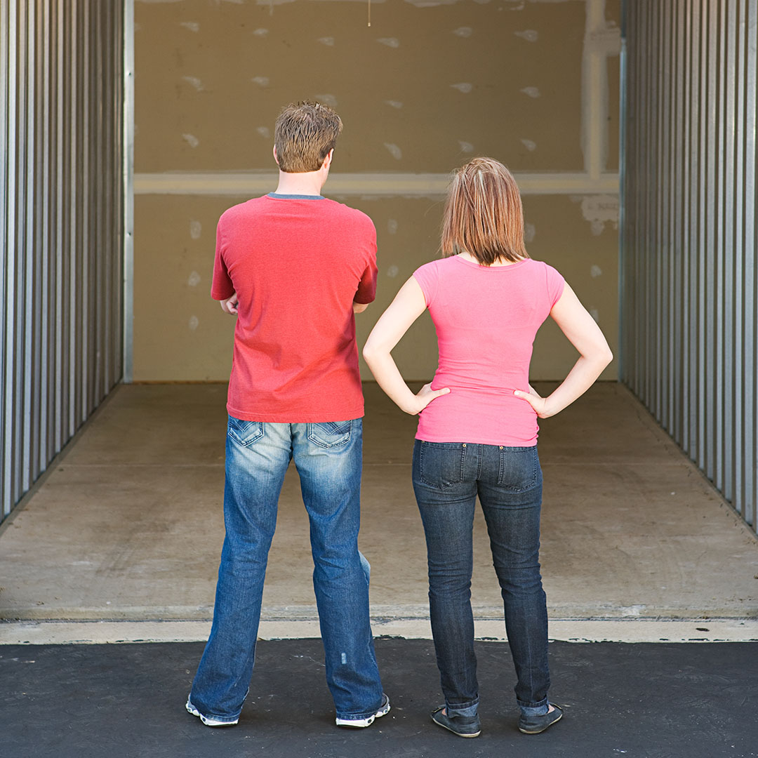 couple looking at an empty storage unit